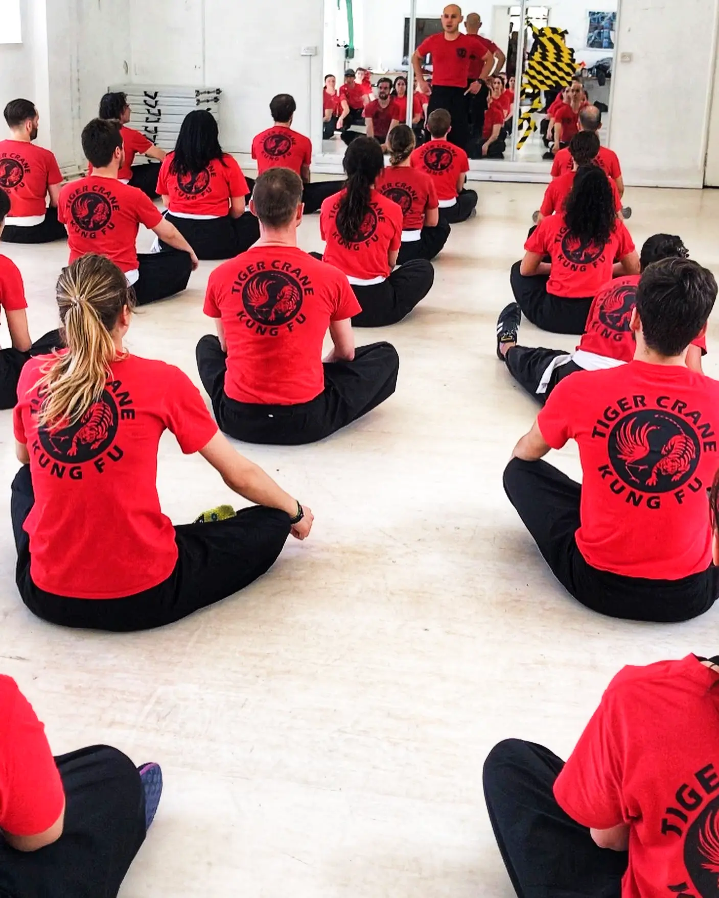 students sitting in kung fu class